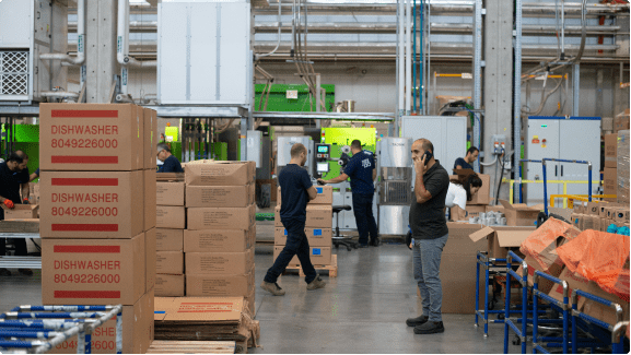 Warehouse team working around stock and production