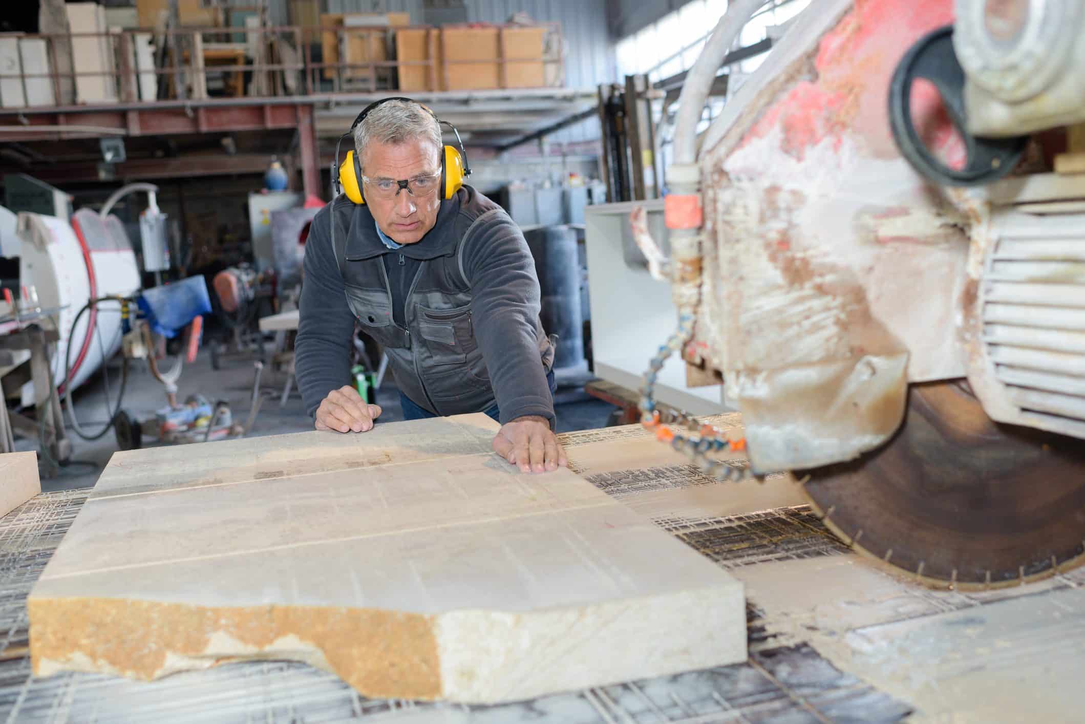 Manufacturing staff reviewing production work on the factory floor